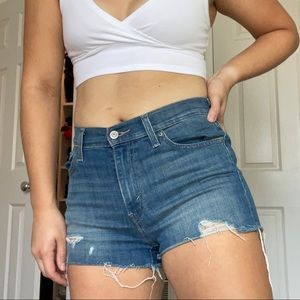 levi’s slightly distressed booty shorts, size 27
